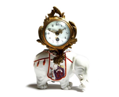 A late 19th century Samson porcelain and ormolu mantel clock in Louis XV style, modelled with an elephant painted in the kaki