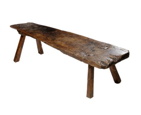 A primitive elm pig bench, the seat branded with initials "G M", possibly Welsh, late 18th / early 19th century and later, 41