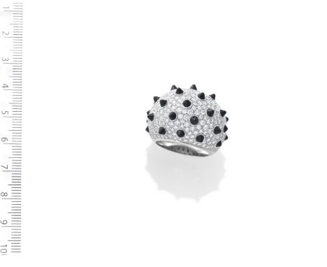 AN ONYX AND DIAMOND 'PANTHÈRE' DRESS RING, BY CARTIEROf bombé form, set throughout with brilliant-cut diamonds and onyx studs