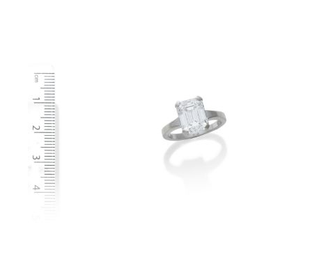 A DIAMOND SINGLE-STONE RINGSet with an emerald-cut diamond weighing 5.04 carats, mounted in 18 carat white gold,  maker's mar