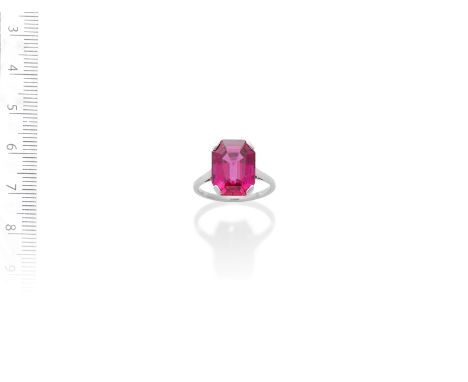 A SPINEL SINGLE-STONE RINGThe octagonal step-cut spinel, weighing 7.64 carats, within a four-claw setting, ring size L½Footno