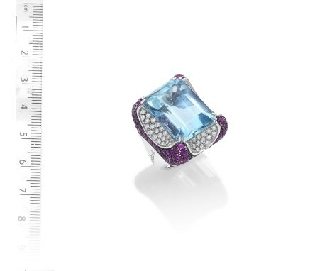 AN AQUAMARINE, RUBY AND DIAMOND DRESS RING,  BY MARGHERITA BURGENERThe step-cut aquamarine within an elaborate mount of conca