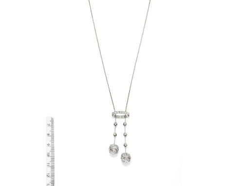 AN EARLY 20TH CENTURY DIAMOND NEGLIGÈE PENDANT/NECKLACEThe cushion-shaped diamond surmount suspending two knifewire drops set