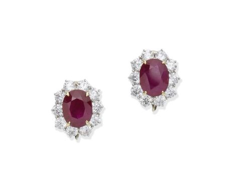 A PAIR OF RUBY AND DIAMOND EARRINGSThe oval-cut rubies framed by surrounds of brilliant-cut diamonds, diamonds approx. 4.00ct