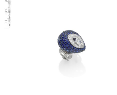 A SAPPHIRE AND DIAMOND 'PAVILION' RING, BY GRAFFThe central pear-shaped diamond, weighing 1.02 carats, within a brilliant-cut