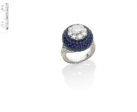 A SAPPHIRE AND DIAMOND 'HALO' RING, BY GRAFFSet with a brilliant-cut diamond, weighing 1.05 carats, within a surround of simi