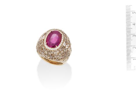 A RUBY AND DIAMOND DRESS RINGThe oval-cut ruby, weighing 8.09 carats, in a bombé mount of brilliant and heart-shaped diamonds