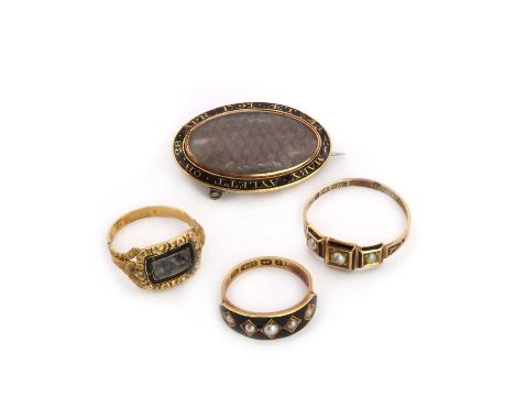 A small collection of Georgian and Victorian mourning jewellery,comprising an early Victorian gold ring with plaited hair gla