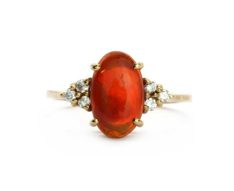 A 9ct gold single stone fire opal ring, an oval cabochon fire opal claw set to a wire collet, with a trefoil cluster of brill