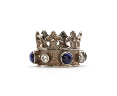 A sterling silver Thomas Sabo crown ring, with a row of alternating sapphire cabochons and cubic zirconia, all rub set to a p