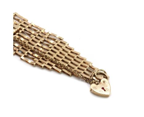 A 9ct gold gate bracelet,ten rows of plain and twisted links, London 1989, to belcher link safety chain and heart padlock, Lo