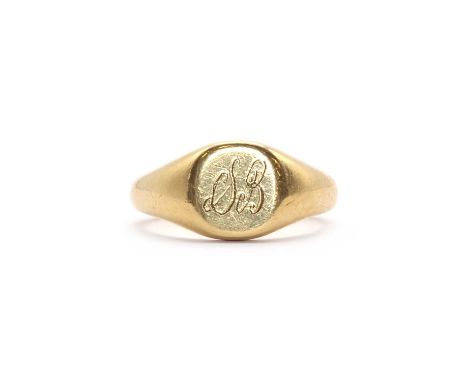 An 18ct gold signet ring,the flat oval head hand engraved with the initials 'SB', to a tapered 'D' section shank, Birmingham 