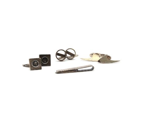 A small collection of mid-century Danish silver gentlemen's jewellery,comprising a pair of Georg Jensen cufflinks no. 91, des