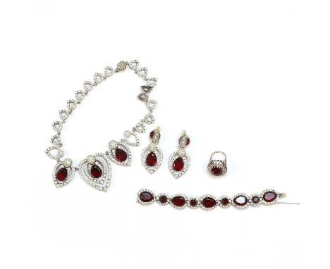 A costume jewellery suite, signed Ciner,comprising a Ciner faux ruby paste and clear paste necklace, three red mixed cut tear