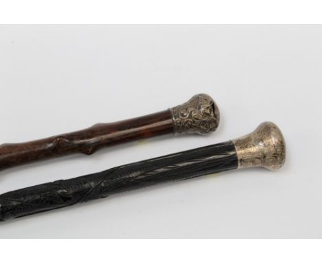 Early 20th century carved Irish black hardwood walking stick with carved shamrock, harp and tower decoration and silver top (