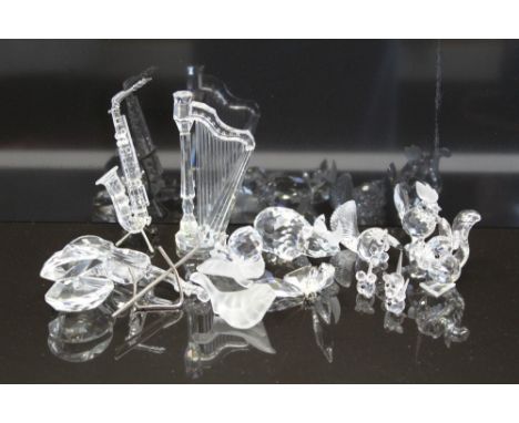 Selection of eleven Swarovski crystal models - Harp, Saxophone, Cello, Rhino, Three Mice, Squirrel, Ant-Eater, Snail on leaf,