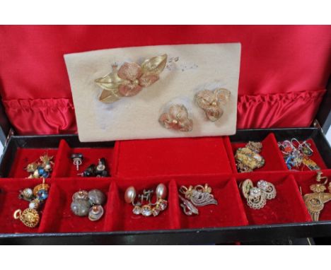 Two jewellery boxes containing costume jewellery, vintage brooches, bead necklaces, two powder compacts and a faux crocodile 