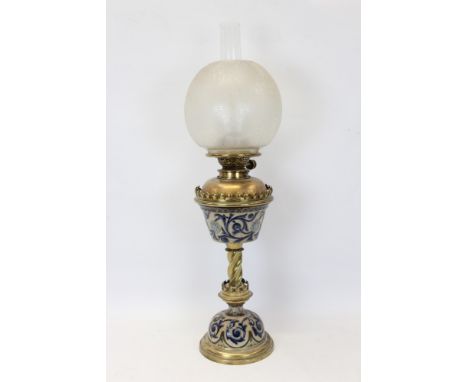 Victorian oil lamp with Hinks burner, twisted brass column, foliate patterned stoneware reservoir and matching base (possibly