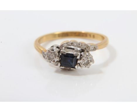 Vintage 18ct gold sapphire and diamond three stone ring with a central square cut blue sapphire flanked by single cut diamond