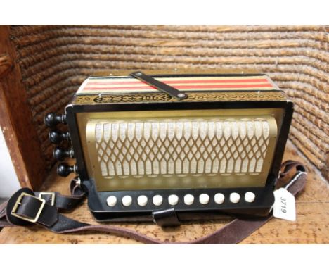 Vintage Hohner one-row button accordion in associated case