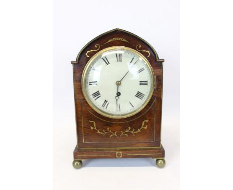 Regency bracket clock with eight day single fusee timepiece movement and white enamel dial with Roman numerals, in a lancet-s