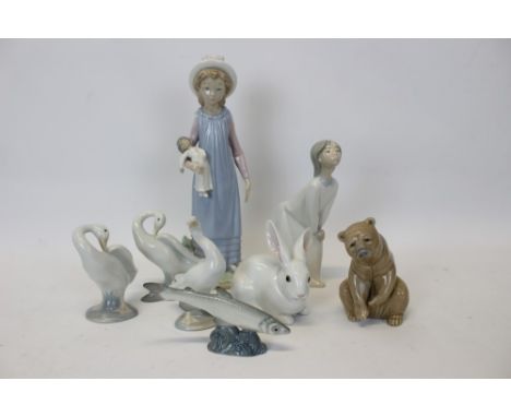 Two Lladro figures, bear, rabbit, three geese and a Russian fish (8)