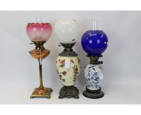 Edwardian oil lamp with Hinks no. 2 burner, copper reservoir with Evered & Co. Patent safety lock collar, brass fluted column