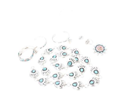 Group of South American Navajo silver and white metal jewellery - to include four bangles / bracelets, a brooch, ring, pair e
