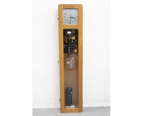 Synchronome electric Master clock with suspension jewel and pendulum, in a light oak case, together with two secondary dials 