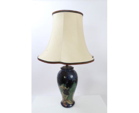 Moorcroft pottery table lamp decorated with black tulips on blue and green ground - impressed marks to base, with shade