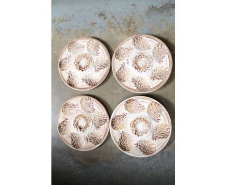 Set of six oyster plates by Sarreguemines, France, decorated with crabs and oyster shells, 24.8cm in diameter