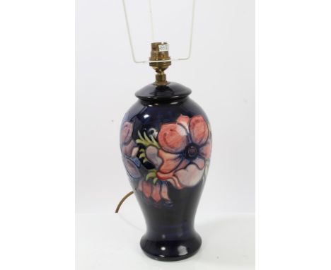 Moorcroft pottery table lamp decorated in the Anemone pattern on blue ground - impressed marks to base, with shade