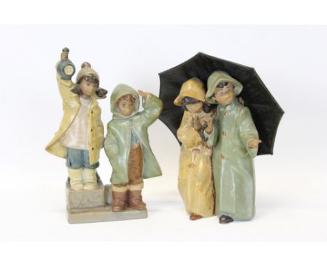 Two Lladro Gres figure groups - boy and girl under an umbrella and boy and girl wearing raincoats  CONDITION REPORT Both figu