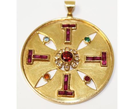 1980s gold (18ct) Aztec-style pendant, set with a central garnet surrounded by a border of eight brilliant cut diamonds, furt
