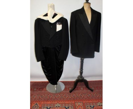 Gentlemen's 1938 black tailcoat, grosgrain lapel, silk-lined, central vent to waistline, high-waisted button fly, double-brai