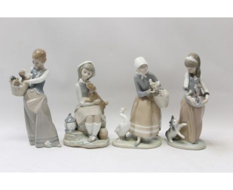 Four Lladro porcelain figures - girl with cat and kittens, girl with puppies, girl with dog and lady with geese