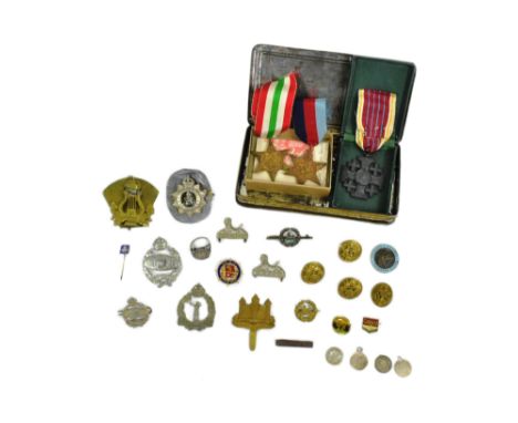 A collection of WWII Second World War British Army cap badges and medals to include; 1939-45 Star, Italy Star, Tank Regiment 