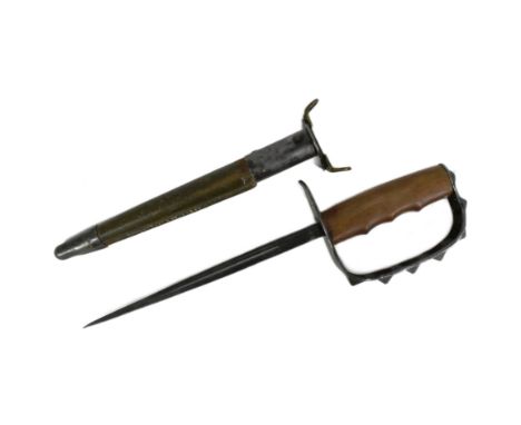 A WWI First World War US United States trench fighting knife. The D shaped knuckle bow with pointed pyramid shaped tips stamp