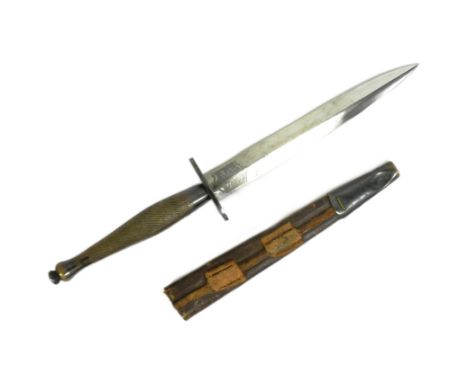 A WWII Second World War British FS Fairbairn Sykes 2nd Pattern commando fighting knife dagger. Typical form with a chequered 