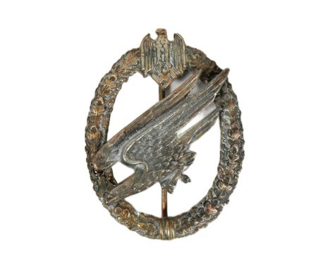 A WWII Second World War German Luftwaffe ' Fallschirmjager ' Paratrooper qualification badge. Central eagle in flight and Swa