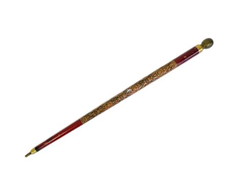 A vintage combination walking stick and snooker cue. The globe shaped pommel unscrews to slide out the top portion of the cue
