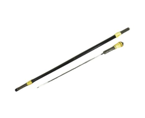 A 19th Century Victorian gentleman's sword stick / walking cane with concealed blade. Dome shaped bone pommel with a white me