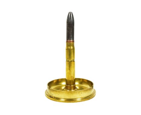 A WWI First World War British 4.5 Howitzer shell case fashioned into a table top lighter. Various stamps to the base, dated 1