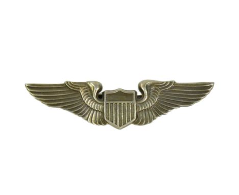 A WWII Second World War USAAF United States Army Air Force pilot wings badge. Stylized wings with a central shield. Marked fo