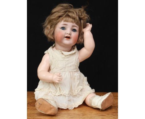 A Kammer &amp; Reinhardt/Simon &amp; Halbig (Germany) bisque head and jointed painted composition bodied baby doll, blue glas