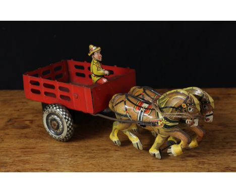 A Marx Toys tinplate and clockwork cart with two horse team, printed lithograph detail, seated driver figure upon red cart, 2