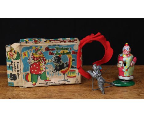 A TPS (Japan) tinplate and fixed clockwork novelty clown trainer and his acrobat dog toy, lithographed tinplate, red felt fir