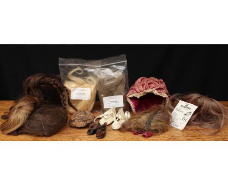 A collection of doll replacement wigs and doll shoes, comprising various replacement wigs including a Forest Fibres 30g premi