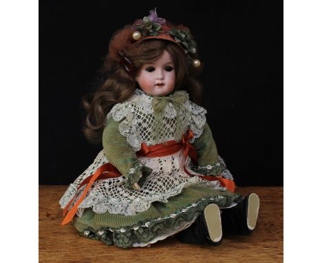 A William Goebel (Germany) bisque head and ball jointed painted composition bodied doll, brown glass eyes, painted features i