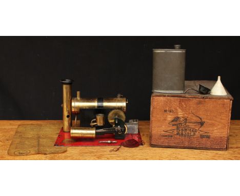 A Bowman Models M135 live steam stationary steam engine, mounted on a rounded rectangular shaped red metal base, single cylin